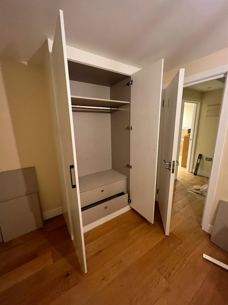 This is an example of a traditional storage and wardrobe in London.