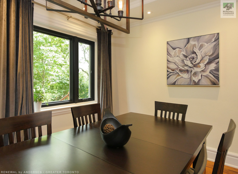 Medium sized enclosed dining room in Toronto with yellow walls, medium hardwood flooring, no fireplace and a drop ceiling.
