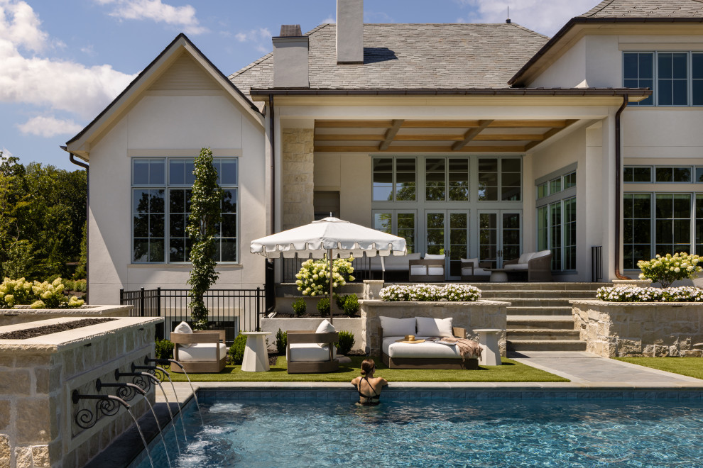 Inspiration for a timeless rectangular pool fountain remodel in Kansas City