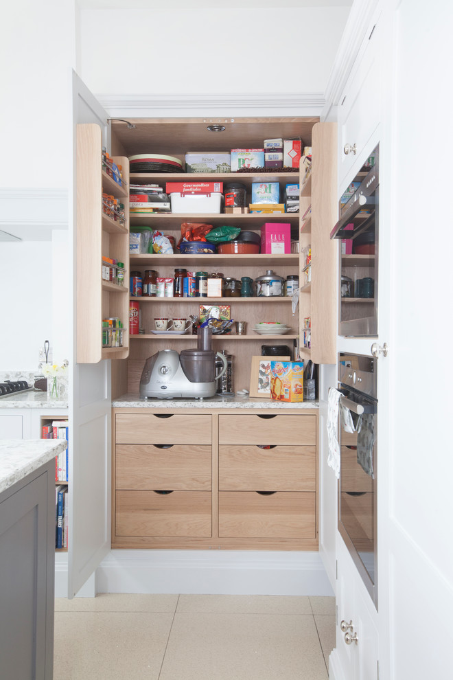 Inspiration for a small transitional kitchen pantry in Cardiff with an undermount sink, shaker cabinets, grey cabinets, grey splashback, stainless steel appliances, ceramic floors and with island.
