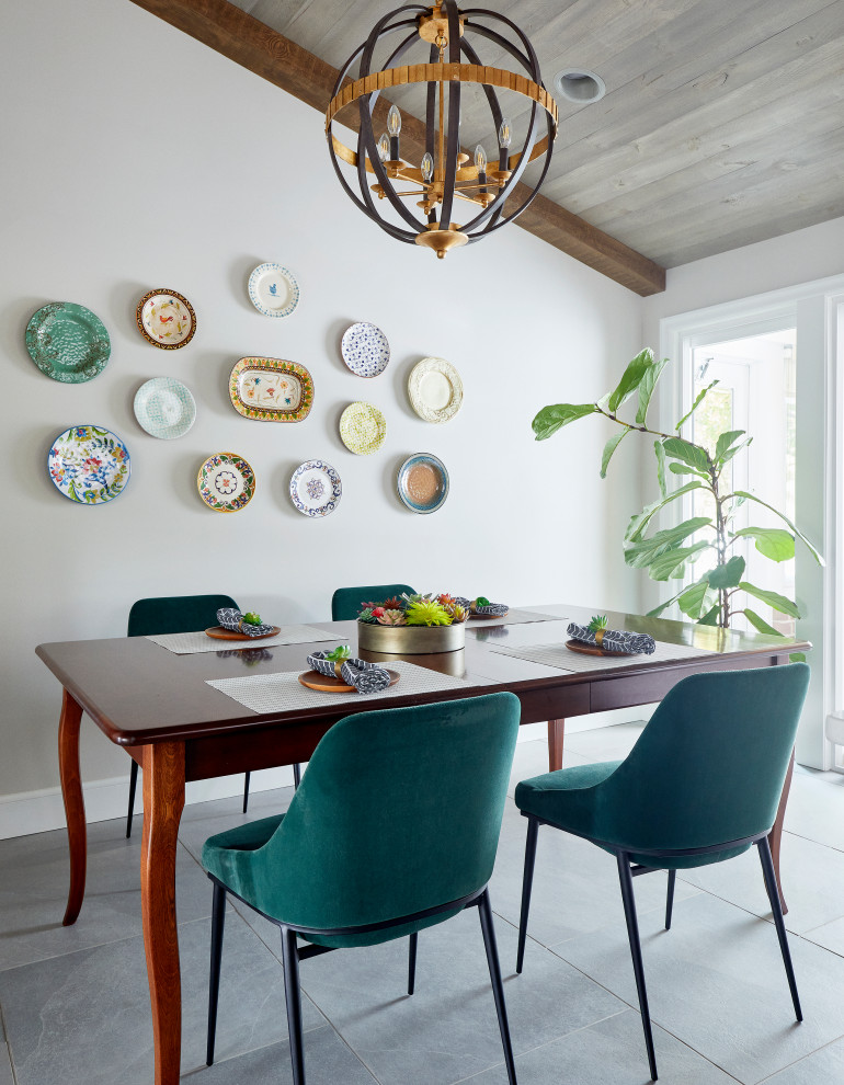 Example of a mid-sized transitional ceramic tile, gray floor and vaulted ceiling kitchen/dining room combo design with white walls and no fireplace