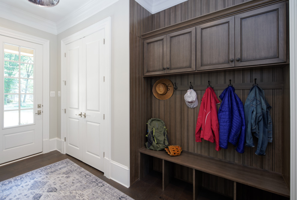 Inspiration for a small traditional mudroom in DC Metro with a white front door, white walls, a single front door, brown floor, dark hardwood floors, coffered and decorative wall panelling.