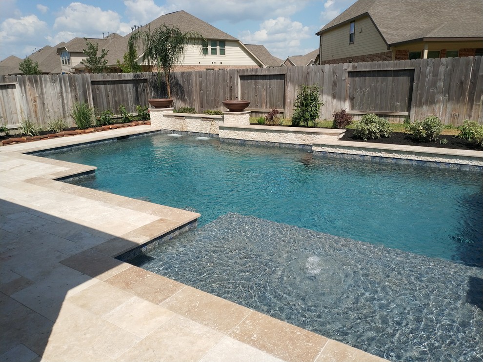 Inspiration for a large transitional backyard stone and rectangular lap hot tub remodel in Houston
