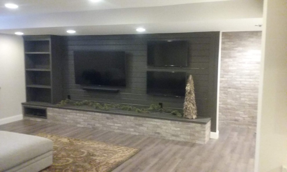 Inspiration for a large transitional fully buried basement in Columbus with beige walls, vinyl floors and brown floor.