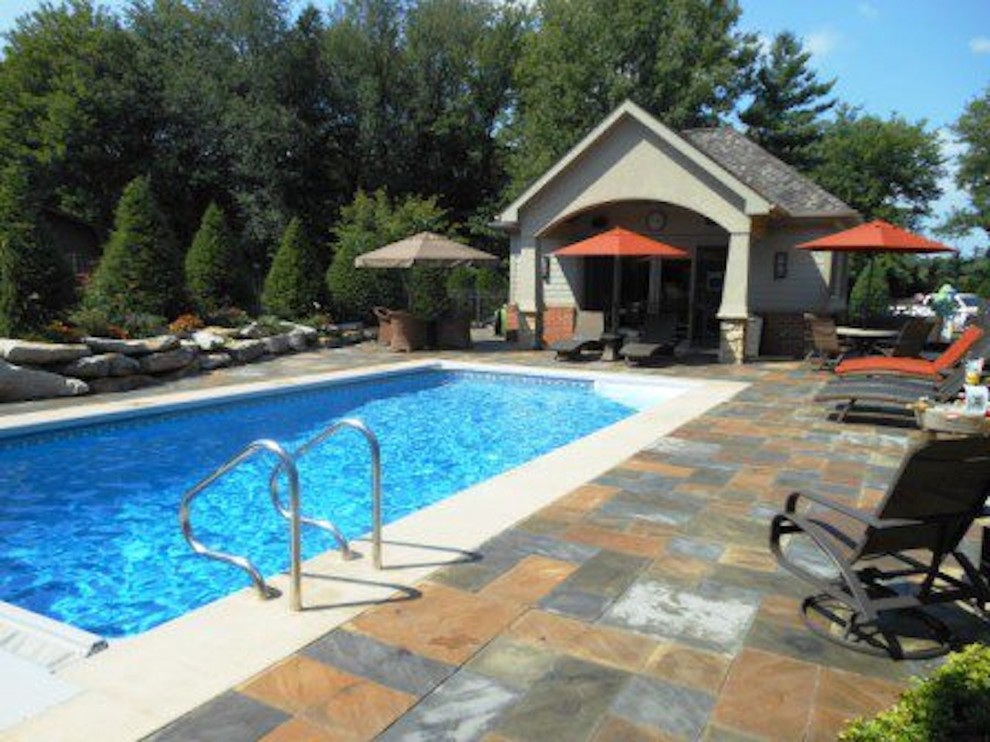 Inspiration for a large transitional backyard stone and rectangular lap pool remodel