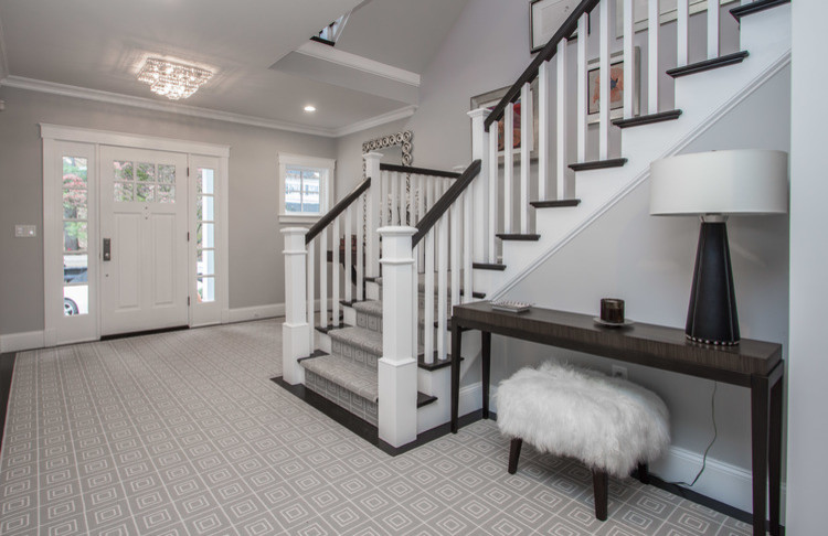 Inspiration for a large transitional foyer in Boston with grey walls, carpet, a single front door and a white front door.