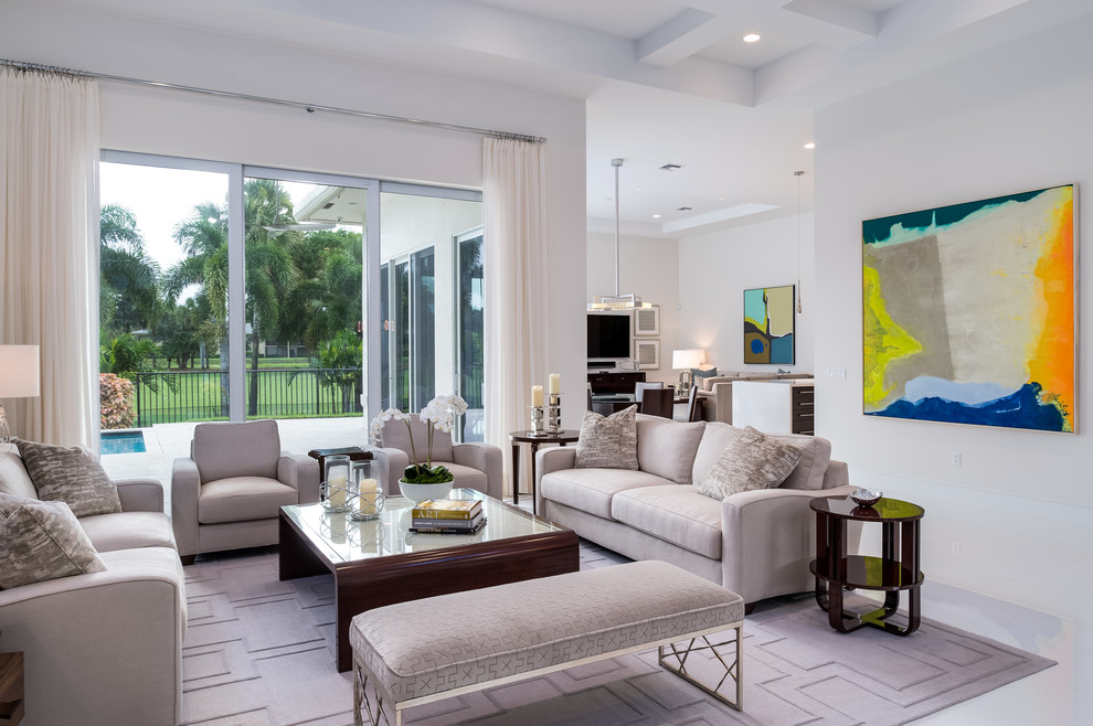 Photo of a mid-sized contemporary formal enclosed living room in Miami with white walls and white floor.