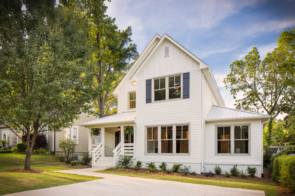 Mid-sized farmhouse white two-story wood gable roof photo in Birmingham