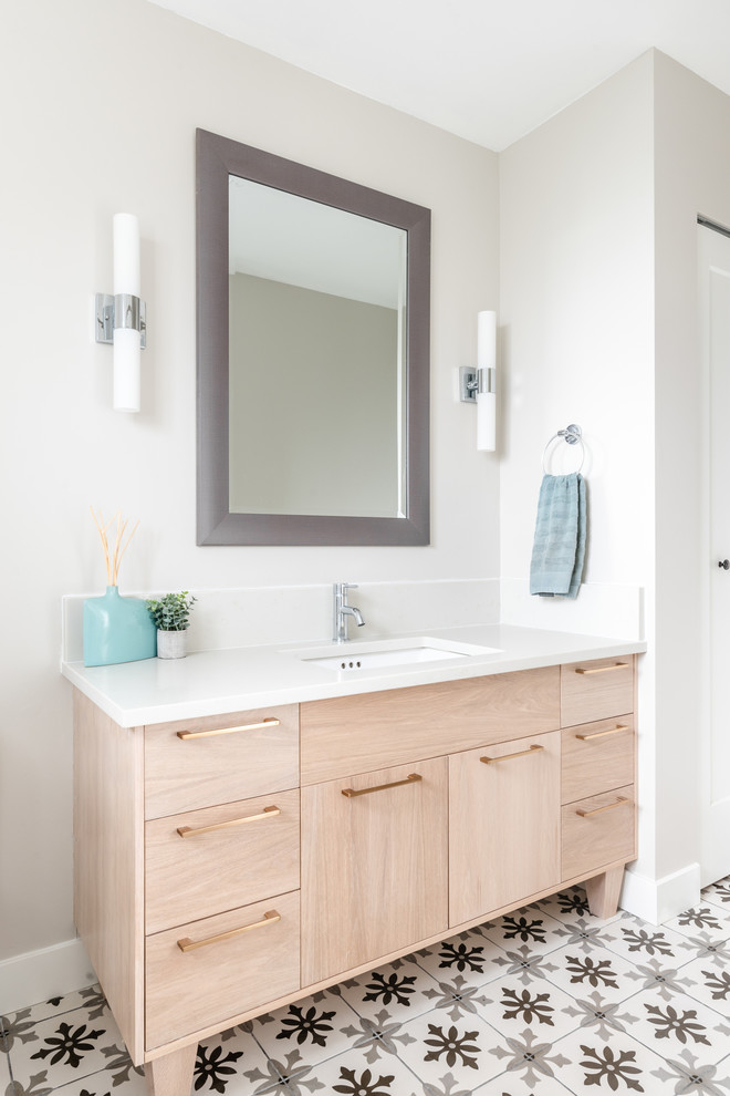 This is an example of a transitional master bathroom in Other with flat-panel cabinets, light wood cabinets, porcelain floors, an undermount sink, engineered quartz benchtops, grey floor and white benchtops.