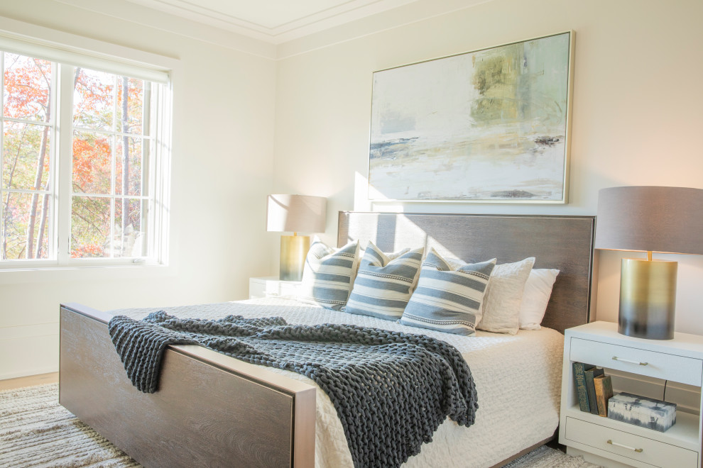 Photo of a mid-sized beach style guest bedroom in Other with white walls, light hardwood floors and white floor.