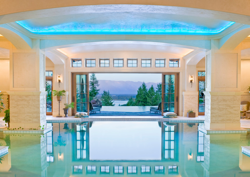 This is an example of an expansive mediterranean indoor custom-shaped pool in Jackson with tile.