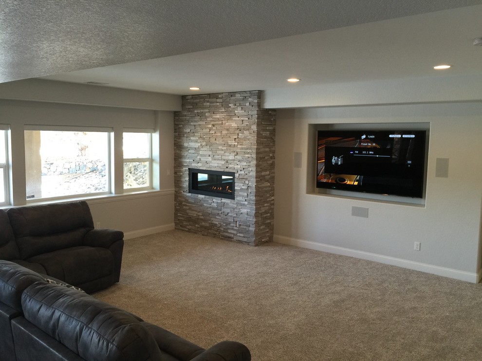 This is an example of a mid-sized transitional look-out basement in Denver with brown walls, carpet, a ribbon fireplace, beige floor and recessed.