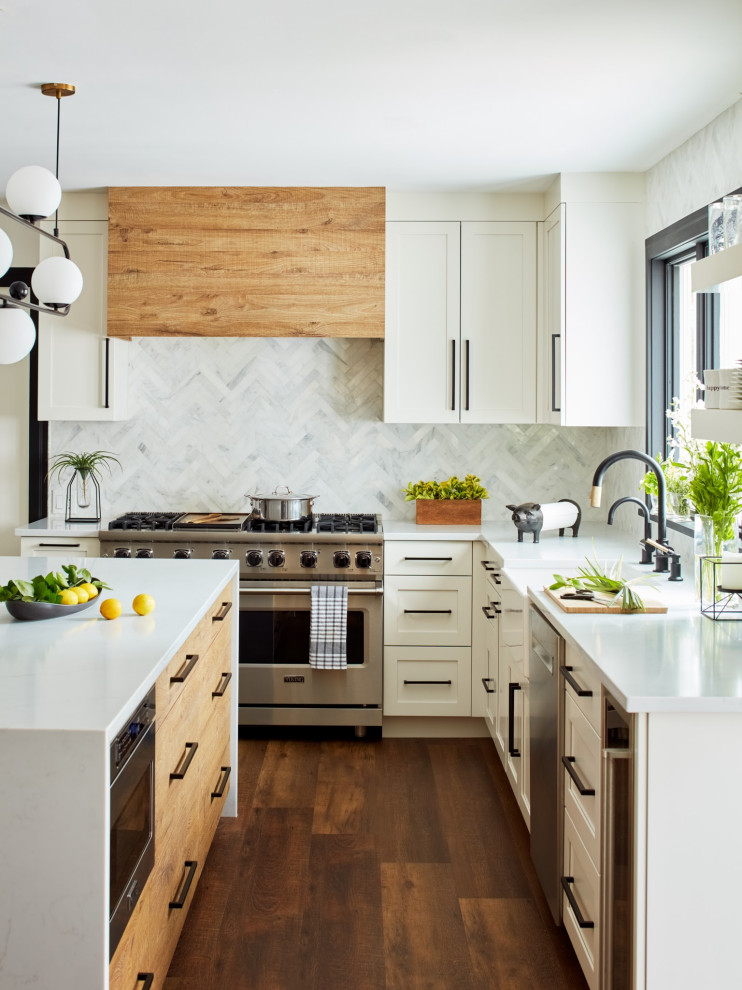 Inspiration for a large country u-shaped eat-in kitchen in New York with a farmhouse sink, shaker cabinets, white cabinets, quartzite benchtops, white splashback, stone tile splashback, stainless steel appliances, porcelain floors, with island, brown floor and white benchtop.