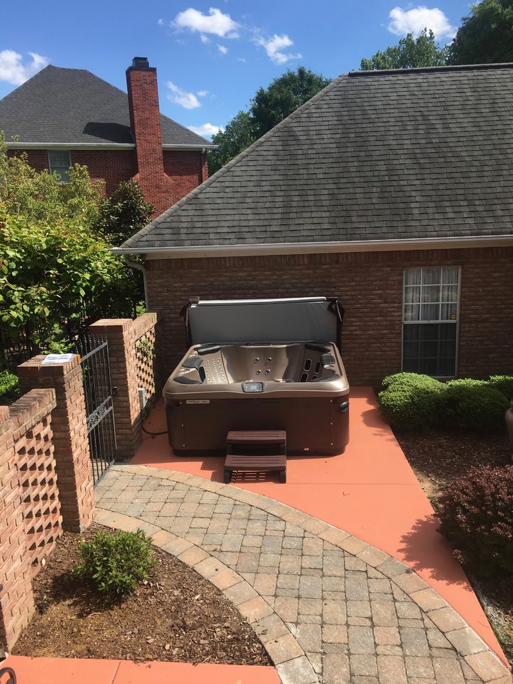 Hot tub - mid-sized transitional backyard concrete and rectangular hot tub idea