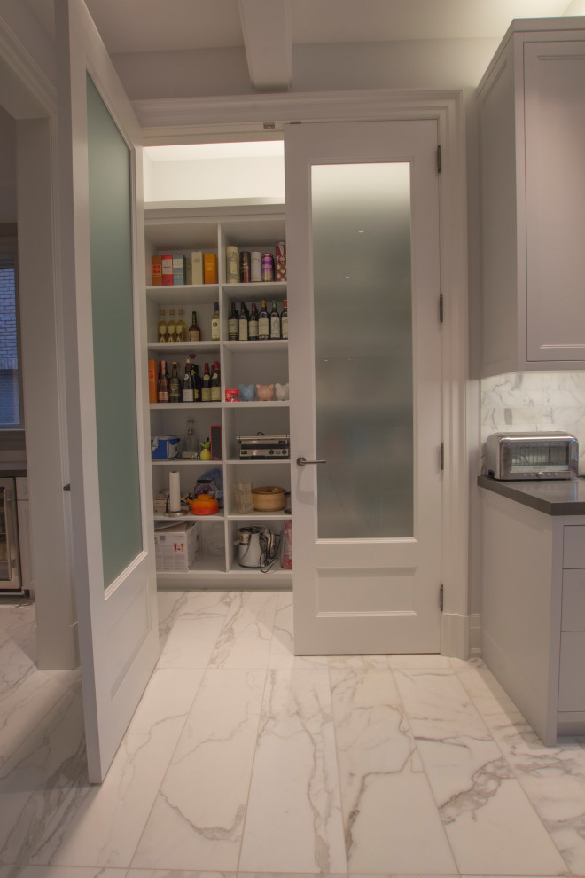 Design ideas for a large traditional l-shaped kitchen pantry in Toronto with an integrated sink, flat-panel cabinets, stainless steel cabinets, engineered stone countertops, white splashback, marble splashback, stainless steel appliances, marble flooring, multiple islands, grey floors, grey worktops and a coffered ceiling.