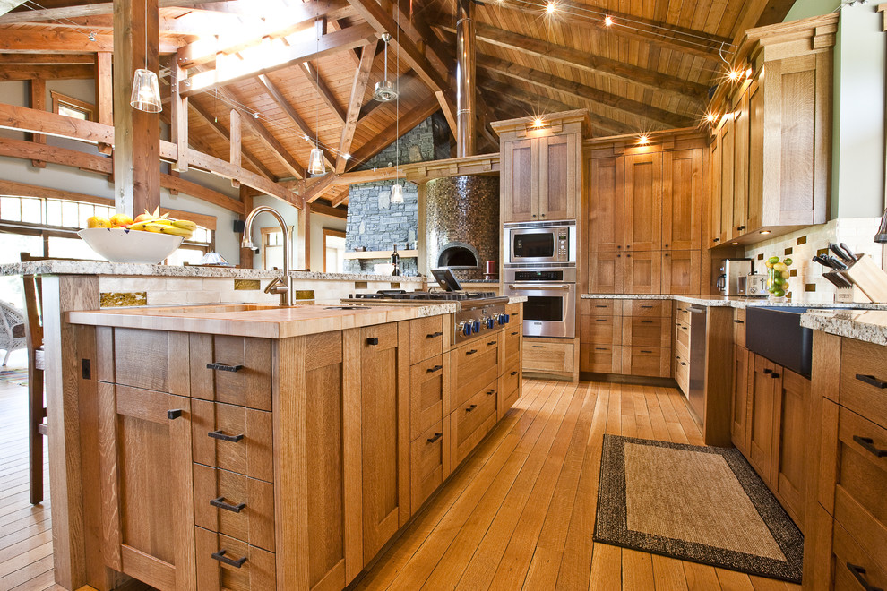 Design ideas for a country kitchen in Calgary with wood benchtops.