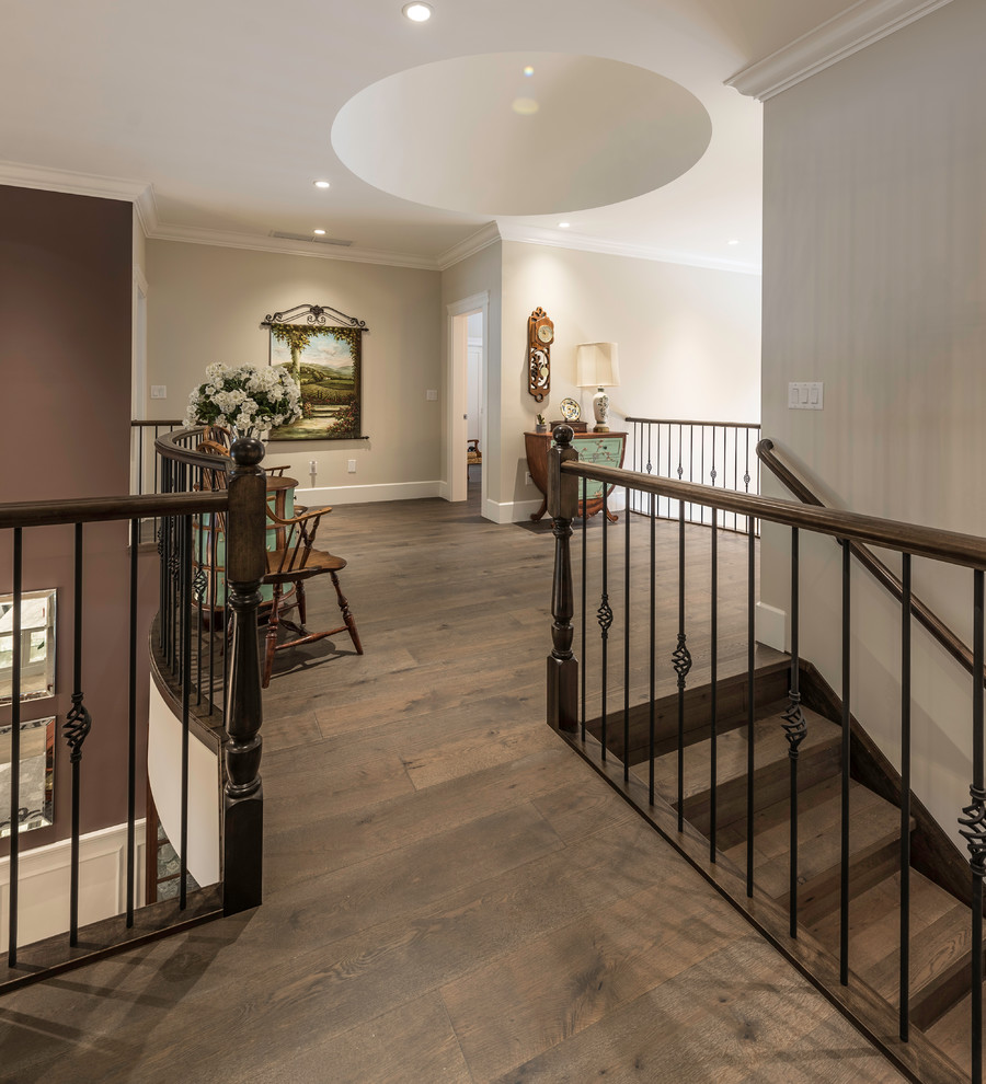Inspiration for a mid-sized traditional hallway in Vancouver with purple walls, medium hardwood floors and brown floor.