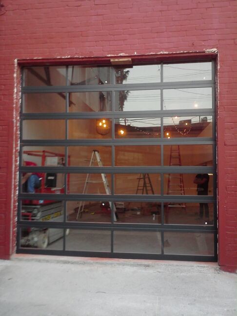Anodized Aluminum & Clear Tempered Glass Garage Doors