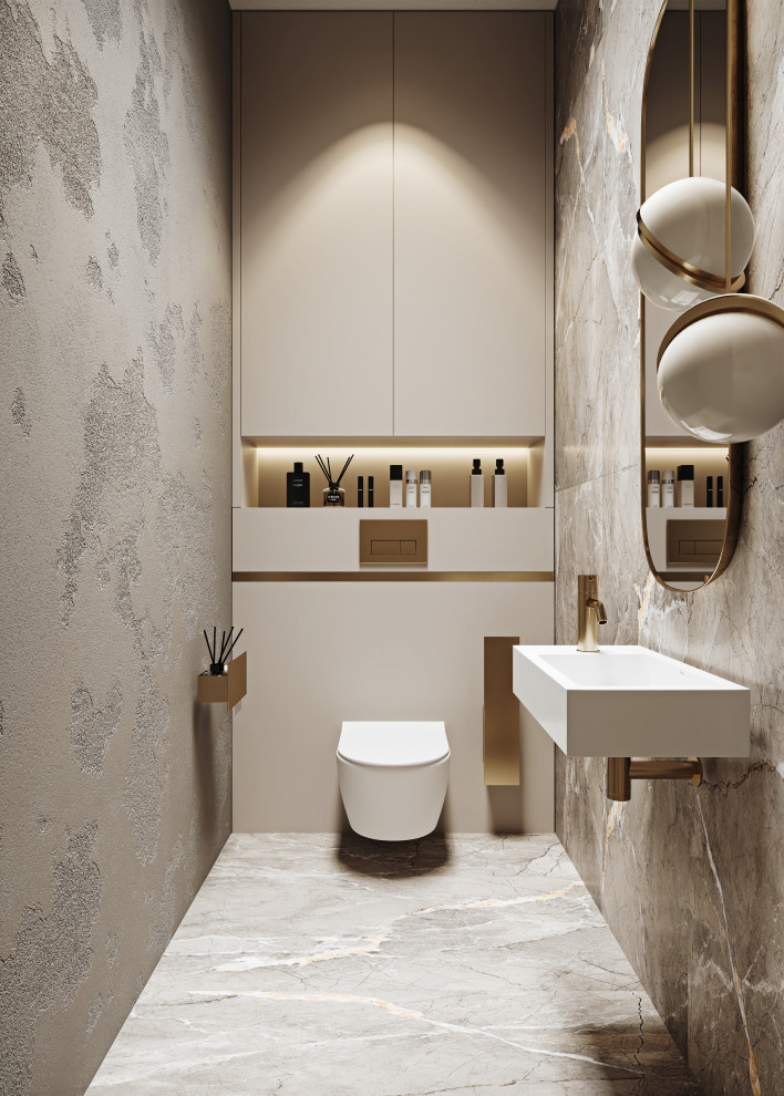 Пример оригинального дизайна: туалет: освещение с плоскими фасадами, бежевыми фасадами, инсталляцией, серой плиткой, цементной плиткой, полом из керамогранита, подвесной раковиной и встроенной тумбой