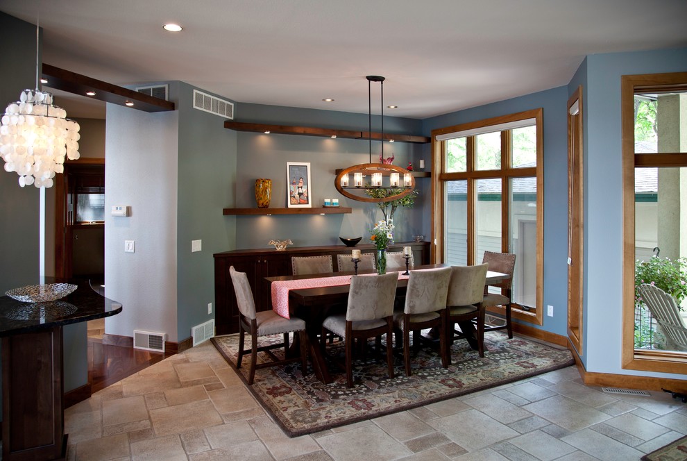 Inspiration for a small transitional travertine floor and beige floor great room remodel with blue walls and no fireplace