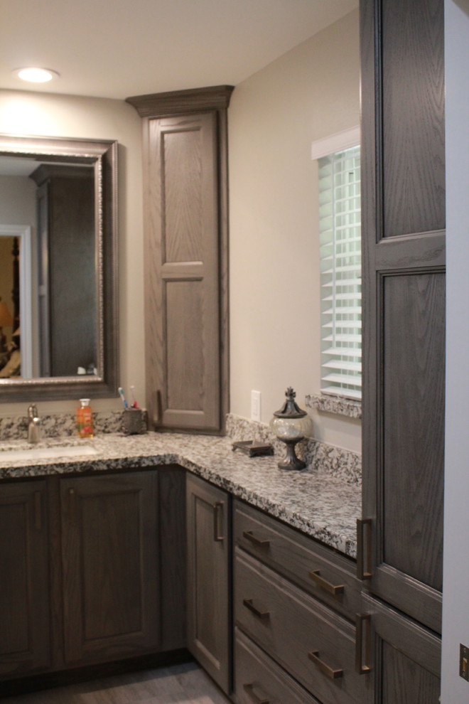 Example of a small transitional master white tile and porcelain tile porcelain tile and gray floor bathroom design in Houston with shaker cabinets, gray cabinets, gray walls, granite countertops and a hinged shower door