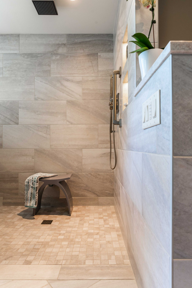 Inspiration for a mid-sized contemporary master bathroom in Minneapolis with shaker cabinets, grey cabinets, a drop-in tub, a curbless shower, a bidet, beige tile, porcelain tile, grey walls, porcelain floors, an undermount sink, quartzite benchtops, beige floor, an open shower and white benchtops.