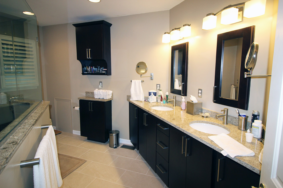 Large contemporary master bathroom in Philadelphia with flat-panel cabinets, black cabinets, beige tile, ceramic tile, beige walls, ceramic floors, an undermount sink and granite benchtops.