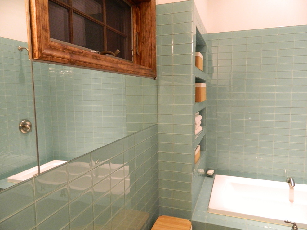 Photo of a contemporary bathroom in Other with a drop-in tub, a shower/bathtub combo, green tile and glass tile.