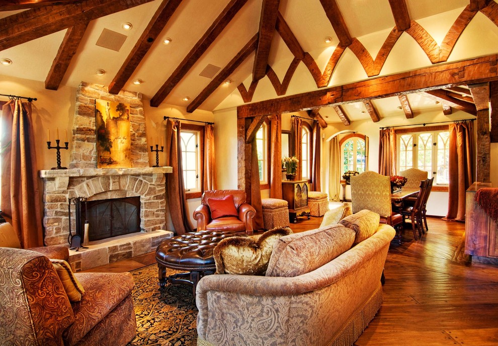 Photo of a traditional living room in Seattle with a stone fireplace surround.