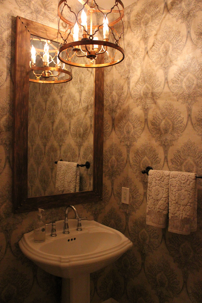 Design ideas for a traditional powder room in Orange County with a pedestal sink.