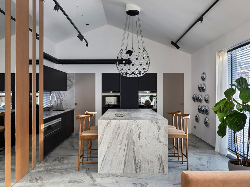 Photo of a contemporary kitchen in Moscow with black cabinets and an island.