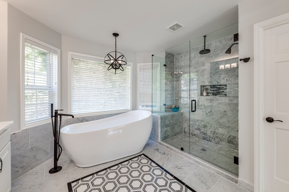 Photo of an expansive master wet room bathroom in Seattle with shaker cabinets, white cabinets, a freestanding tub, a one-piece toilet, white tile, marble, blue walls, marble floors, an undermount sink, quartzite benchtops, white floor, a shower curtain and white benchtops.