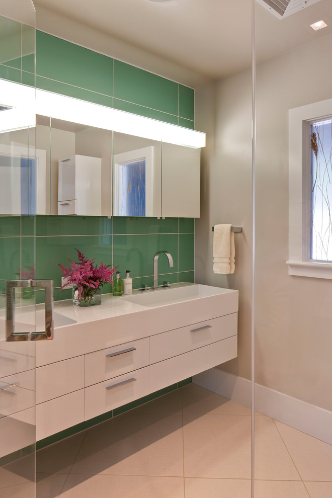 Inspiration for a large contemporary bathroom in Boston with an integrated sink, flat-panel cabinets, white cabinets, green tile, porcelain tile, beige walls, porcelain floors, engineered quartz benchtops and beige floor.