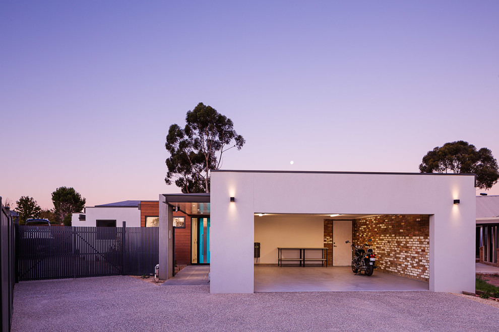 Photo of a large contemporary house exterior in Melbourne with a flat roof.