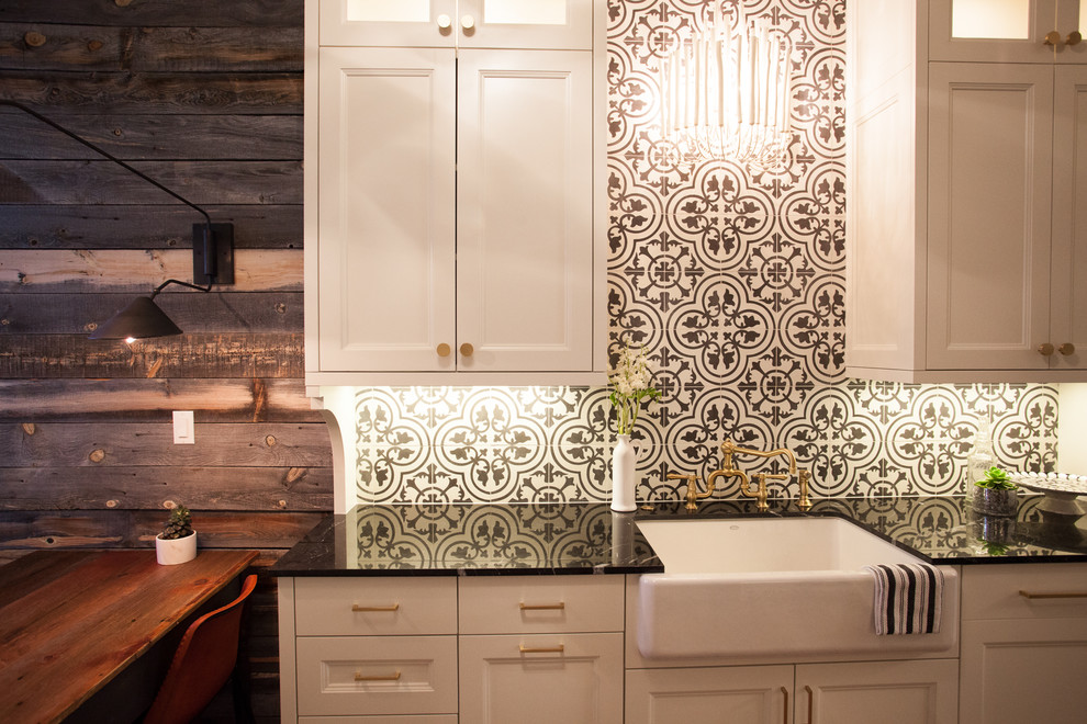 Transitional eat-in kitchen photo in Denver with a farmhouse sink, shaker cabinets, white cabinets, marble countertops, multicolored backsplash, cement tile backsplash and paneled appliances