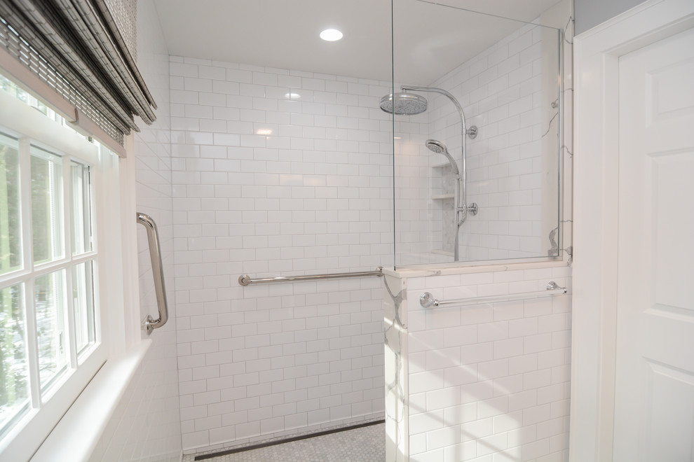 Photo of a small transitional master bathroom in Boston with recessed-panel cabinets, grey cabinets, a curbless shower, a two-piece toilet, white tile, subway tile, grey walls, marble floors, an undermount sink, solid surface benchtops, grey floor, an open shower and green benchtops.
