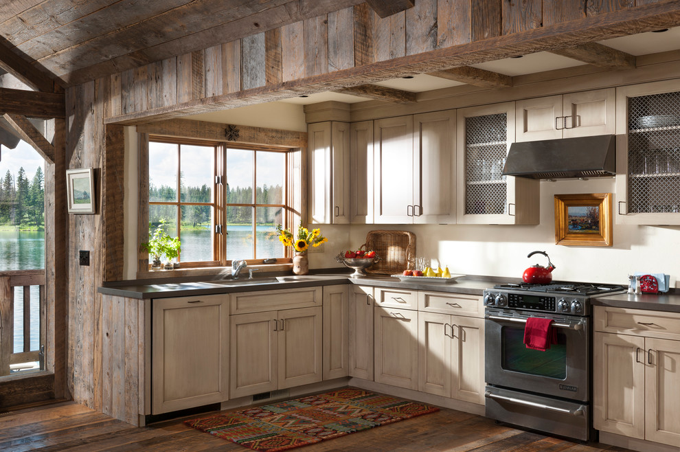 Design ideas for a country kitchen in DC Metro with an undermount sink, shaker cabinets, beige cabinets, stainless steel appliances and dark hardwood floors.