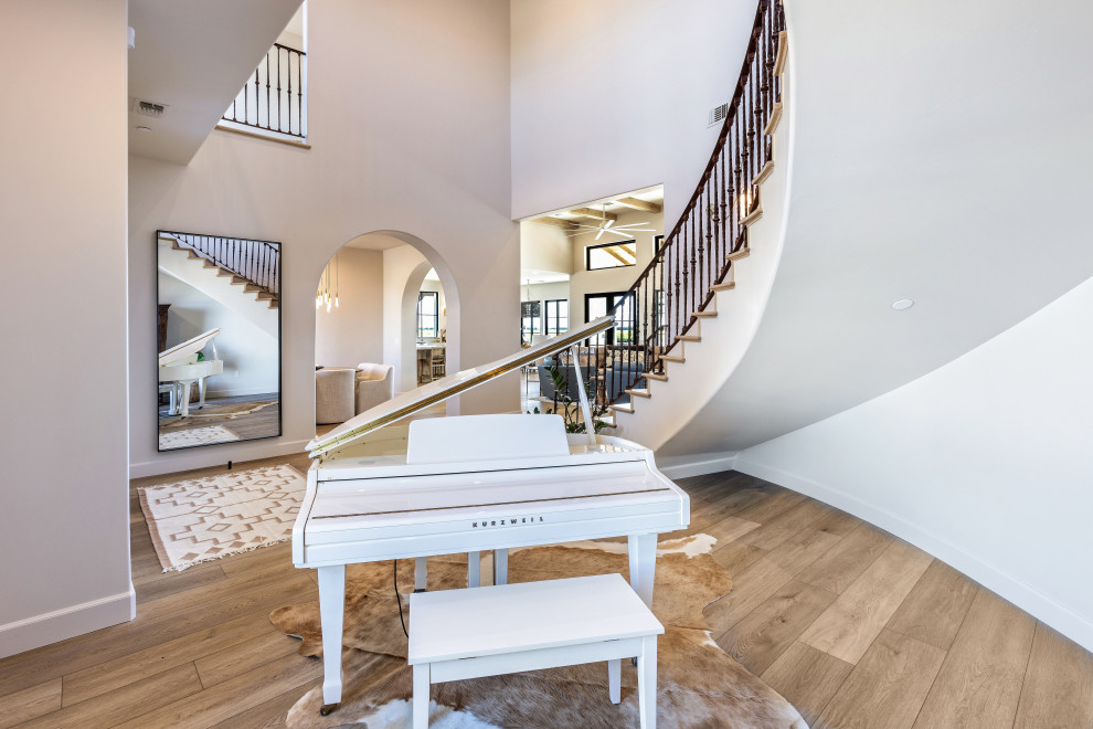 Foyer Curved Staircase and Grand Piano | Tuscan Farmhouse