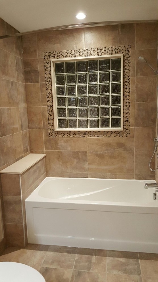 This is an example of a mid-sized transitional kids bathroom in Montreal with a drop-in sink, flat-panel cabinets, dark wood cabinets, engineered quartz benchtops, an alcove tub, a two-piece toilet, beige tile, ceramic tile, beige walls and ceramic floors.