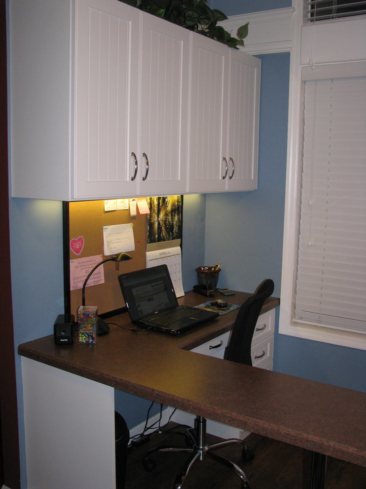 Photo of a mid-sized traditional study room in Miami with beige walls, carpet, no fireplace, a built-in desk and brown floor.