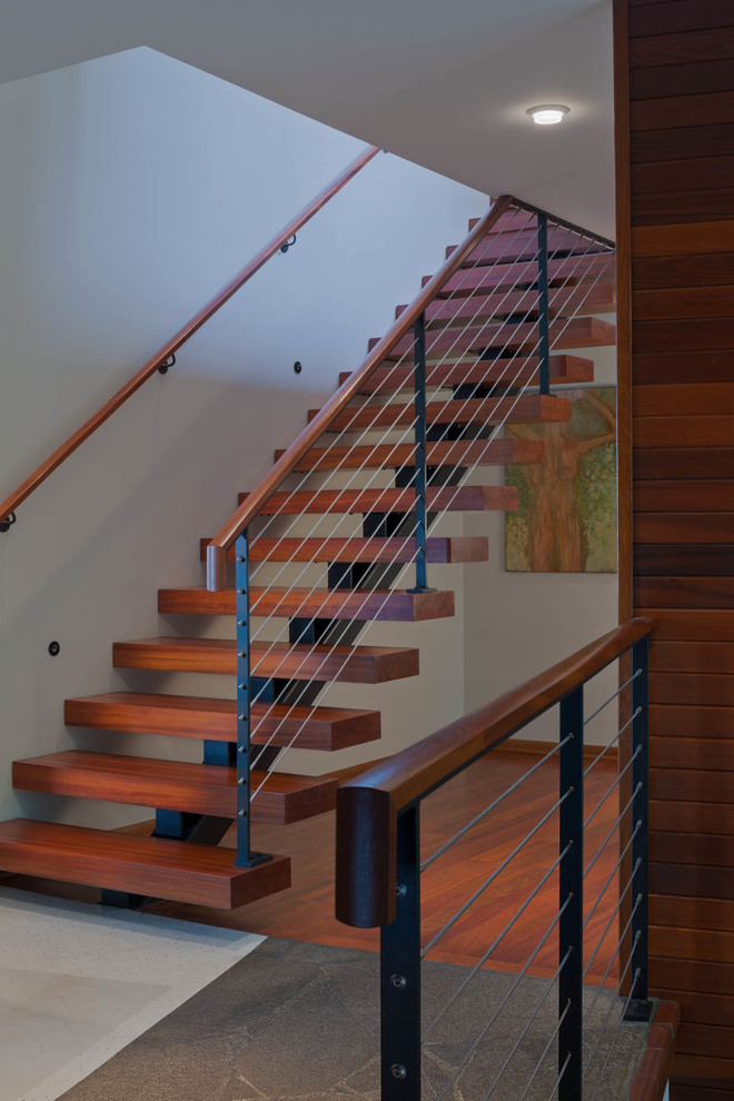 Inspiration for a mid-sized midcentury wood straight staircase in Seattle with open risers.