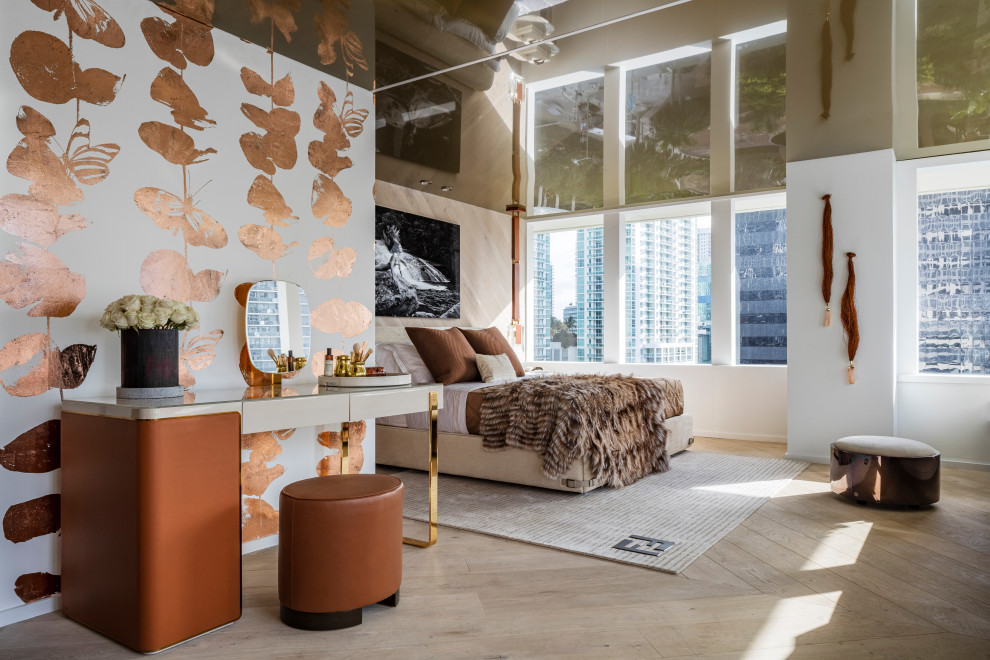 Mid-sized contemporary master bedroom in Miami with beige walls, light hardwood floors, beige floor, wallpaper and wallpaper.