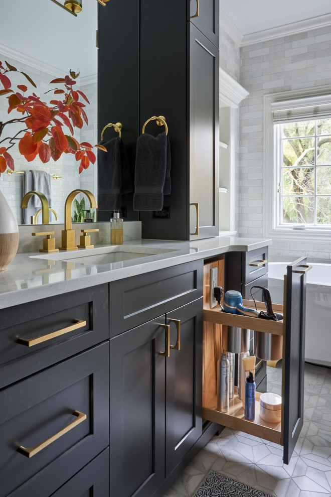 Freestanding bathtub - large transitional master double-sink freestanding bathtub idea in Chicago with shaker cabinets, brown cabinets and an undermount sink