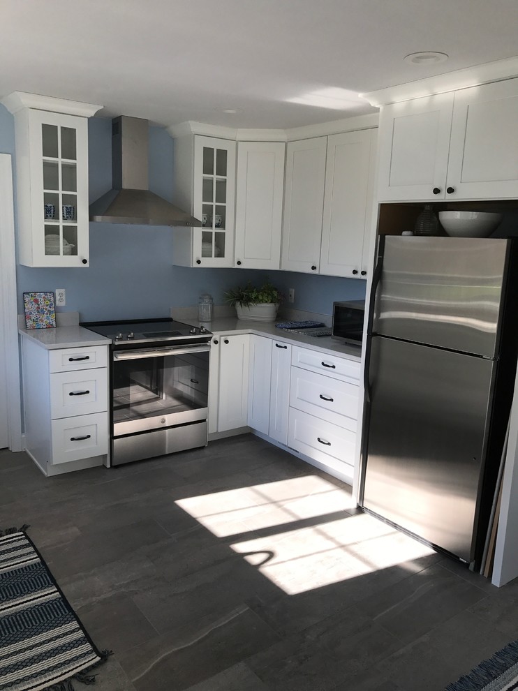Mid-sized transitional porcelain tile and gray floor eat-in kitchen photo with a double-bowl sink, shaker cabinets, white cabinets, quartz countertops, stainless steel appliances, no island and gray countertops