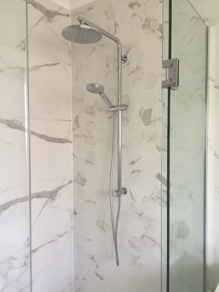 This is an example of a mid-sized eclectic master bathroom in Auckland with an alcove shower, white tile, porcelain tile, white walls and porcelain floors.