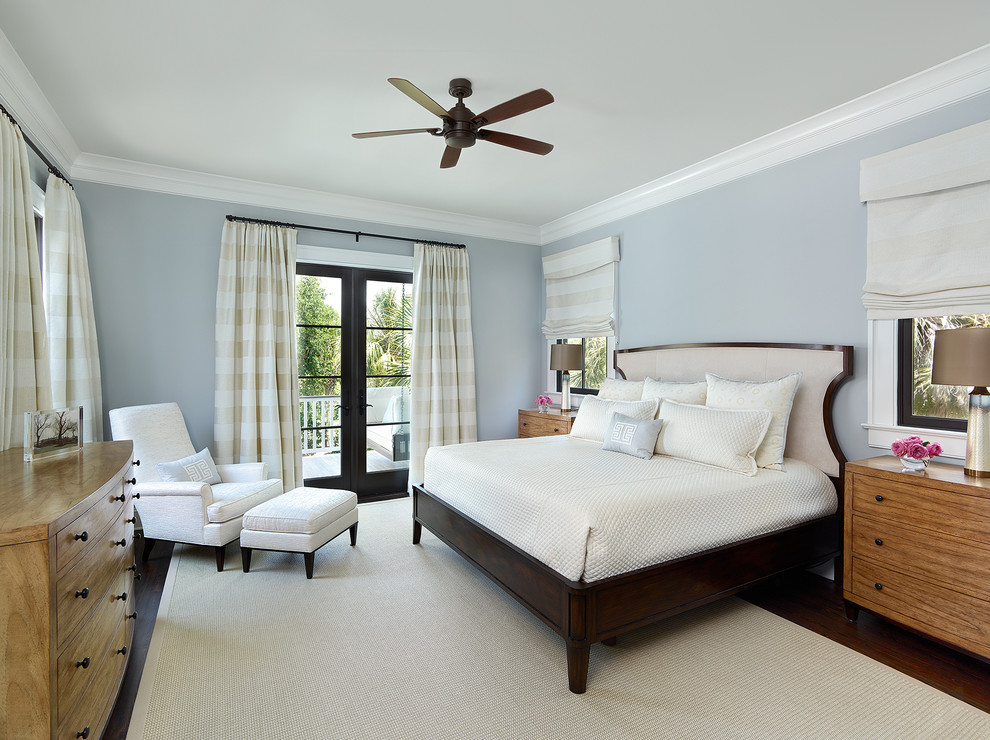 This is an example of a mid-sized transitional master bedroom in Charleston with grey walls and dark hardwood floors.