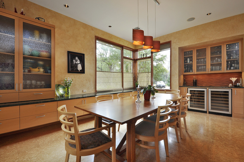 Photo of a contemporary dining room in Austin with medium hardwood floors.