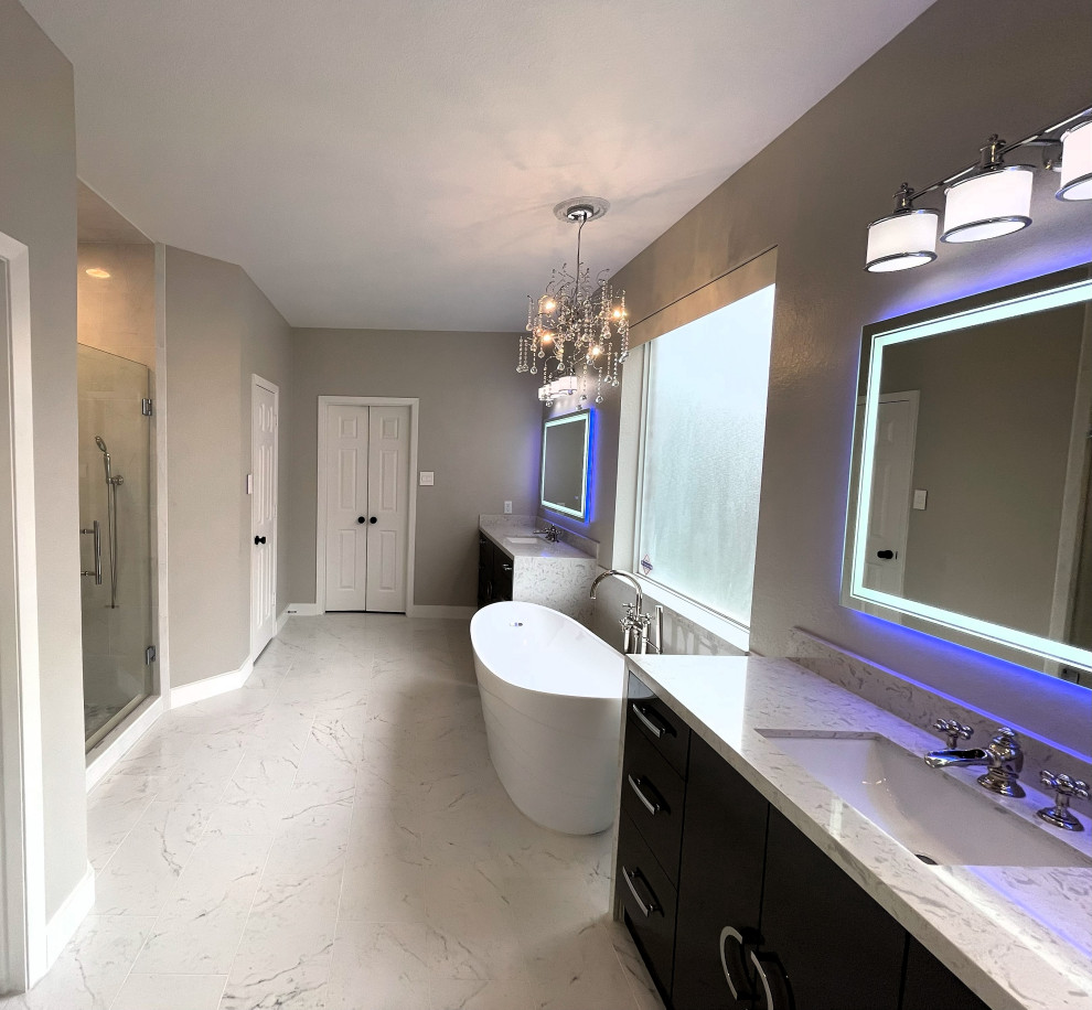 Design ideas for a contemporary master bathroom in Houston with flat-panel cabinets, grey cabinets, a freestanding tub, white tile, porcelain tile, grey walls, porcelain floors, engineered quartz benchtops, white benchtops, a double vanity and a built-in vanity.