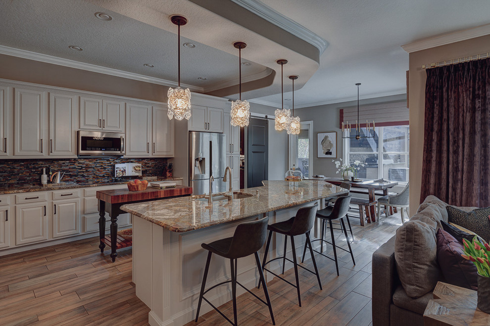 This is an example of a large eclectic kitchen in Orlando with porcelain floors and beige floor.