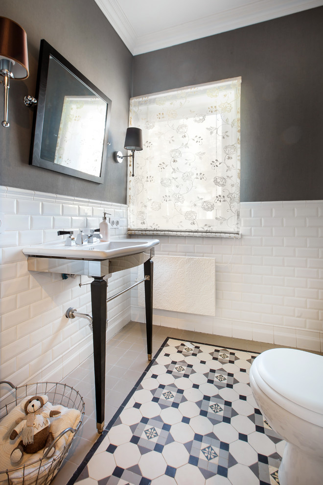 This is an example of a transitional powder room in Moscow with white tile, multi-coloured tile, subway tile, black walls, a console sink and multi-coloured floor.